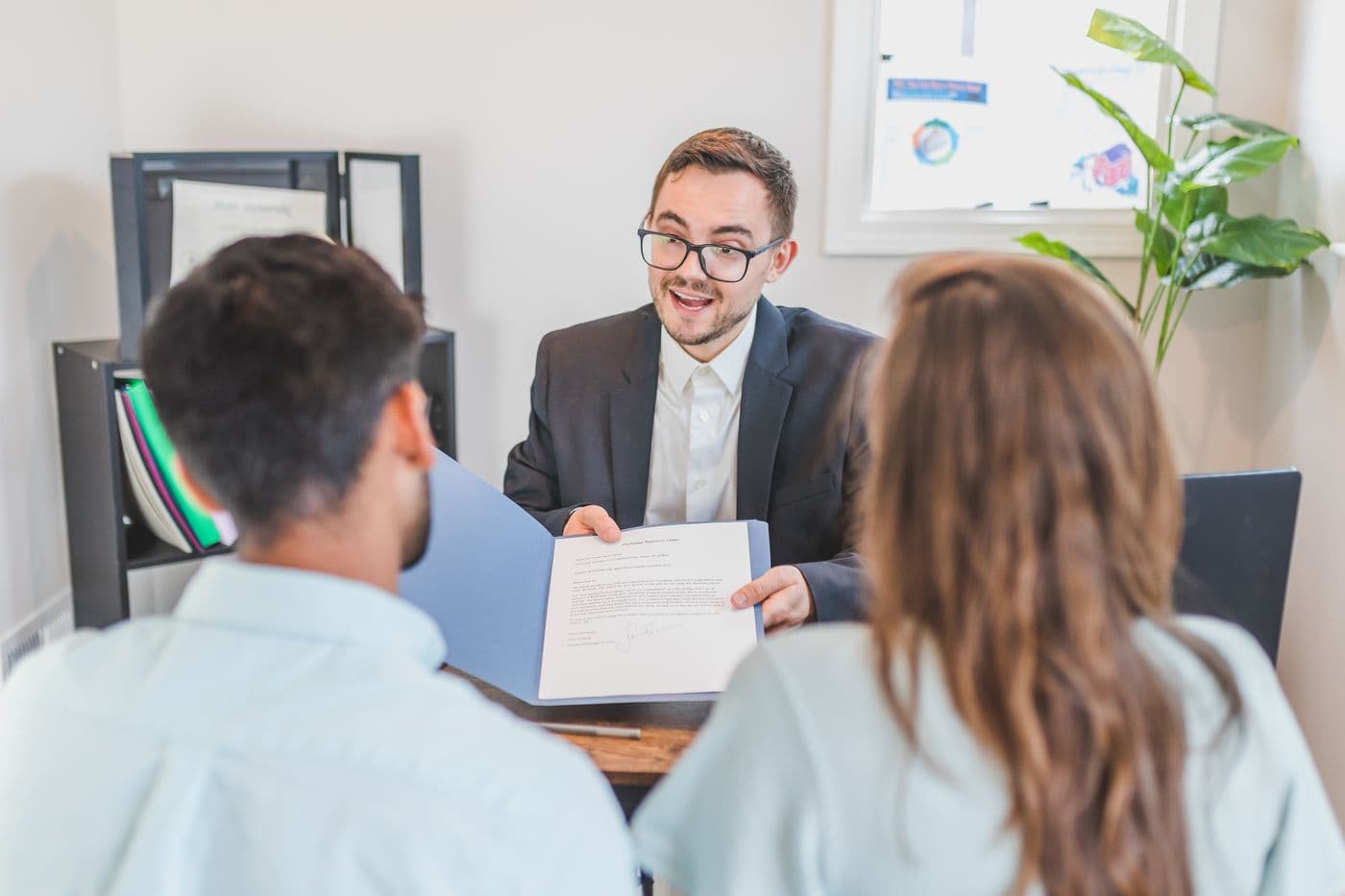 An adviser going through a contract with two clients